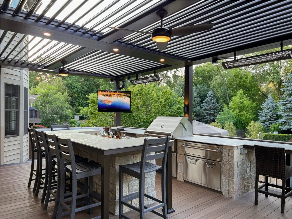 Custom outdoor kitchen with a stone BBQ island